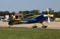 N117CV @ KOSH - Extra EA-300/L - by Mark Pasqualino