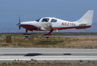 N621SL @ KSQL - Palo Alto-based 2005 Lancair LC41-550FG over the threshold @ nearby San Carlos Airport, CA - by Steve Nation