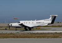 N828SA @ KSQL - Surf Airlines PC-12/47E rolling for take-off to their San Diego Area terminal (KCRQ McClellan-Palomar Airport) @ San Carlos Airport, CA (SF Bay Area terminal) - by Steve Nation