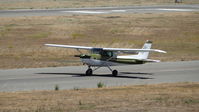 N67384 @ KRHV - Locally-based 1978 Cessna 152 landing on runway 31L at Reid Hillview Airport, San Jose, CA. Photo taken from the control tower. - by Chris Leipelt
