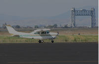 N6469N @ KAPC - Ukiah Broadcasting Corp. (Stockton, CA) 1978 Cessna T210N taxiing @ Napa County Regional Airport, CA with iconic Napa River RR Bridge in background - by Steve Nation