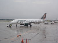 N947FR @ CVG - Frontier Airlines A319 Pushing Back for Atlanta - by Christian Maurer