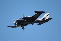 N1144Q @ MCO - Cessna 310H painted like a U-3 - by Florida Metal