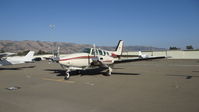 N587AN @ KRHV - Locally-based Beechcraft Baron 58 sitting at the south tie downs at Reid Hillview Airport, San Jose, CA while the Nice Air ramp gets resurfaced. This is the busiest you will ever see the south tie downs since (as of this date) there are only 11 a/c there. - by Chris Leipelt