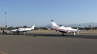 N415CJ @ KRHV - Stratos Aviation LLC (Los Gatos, CA) 2007 Socata TBM-850 sitting next to a transient Piper Navajo at Reid Hillview Airport, San Jose, CA. Such a beautiful sight to see two rare planes next to each other! - by Chris Leipelt