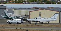 N121BD @ KRHV - Locally-based 1979 Cessna 414A being moved from its tie down spot for the first time since 2009. Not airworthiness, so they had to connect a tow-bar onto a suburban then re position it to TradeWinds for LOTS of maintenance. Photo taken from the ATC tower. - by Chris Leipelt