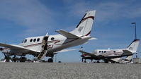 N12GJ @ KPAO - Reid Hillview-based 1972 Beechcraft King Air E90 just after landing parked next to another transient King Air at Palo Alto Airport, Palo Alto, CA. - by Chris Leipelt