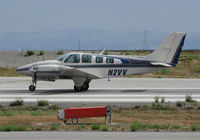 N2VV @ KSQL - Redding, CA-based 1976 Beech 58TC on takeoff roll for KLVT (Livermore, CA) @ San Carlos Municipal Airport, CA - by Steve Nation