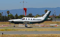 N700PU @ KRHV - TBM Ventures LLC (Pendleton, OR) Socata TBM-700 departing runway 13L at Reid Hillview Airport, San Jose, CA. - by Chris Leipelt