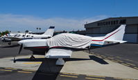 N715J @ KRHV - Nevada-based Glasair (with cover) sitting on the Nice Air helipads at Reid Hillview Airport, San Jose, CA. - by Chris Leipelt