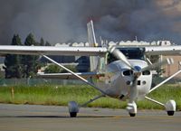 N5ZZ @ KRHV - Locally-based 1977 Cessna 182Q taxing in to its tie down (with huge fire burning south of Eastridge Mall) at Reid Hillview Airport, San Jose, CA. - by Chris Leipelt