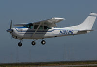N182WD @ KSQL - Locally-Based 1979 Cessna TR182 Turbo Skylane RG over the threshold @ San Carlos Airport, CA - by Steve Nation