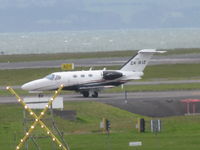 ZK-RJZ @ NZAA - A long range (max zoom) shot of this newish Wellington based mini biz. Waiting to depart. - by magnaman