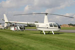 G-CDUE @ EGBR - Robinson R44 Raven at The Real Aeroplane Club's Helicopter Fly-In, Breighton Airfield, September 20th 2015. - by Malcolm Clarke