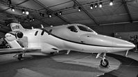 N959EN @ KOSH - Wells Fargo Bank (Salt Lake City, UT) 2015 HondaJet on display on display at EAA AirVenture 2015. Very rare aircraft! - by Chris Leipelt