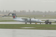 C-GSTA @ CYVR - Getting towed from hangar to terminal - by Remi Farvacque