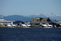C-GEND @ YVR - Now in Harbour Air style livery. With other Harbour Air seaplanes . - by metricbolt