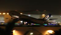 JA12KZ @ LAX - NCA Cargo 747-8 operating in the dark, shot from hotel - by Florida Metal