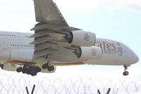 A6-EDU @ EGCC - about to touchdown on runway 23r, taken from The Airport Inn garden viewing area, - by Jez-UK