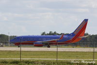 N215WN @ KRSW - Southwest Flight 2603 (N215WN) departs Southwest Florida International Airport enroute to Baltimore/Washington International Airport - by Donten Photography