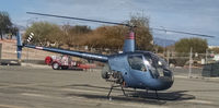 N350VH @ KVGT - N350VH on the ground at 702 Helicopters at KVGT, rotors spun up, about to take off.

7C, wind 320 at 8, and 0911PST. - by Ehud Gavron