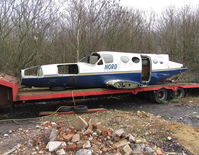 EC-JCC @ EGTB - Fuselage of Cessna 421C ex Nordjet Airlines on a trailer at Wycombe Air Park. - by moxy