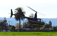 N220GG @ KRHV - Locally-based 2009 Robinson R44 II departing at Reid Hillview Airport, San Jose, CA. - by Chris Leipelt