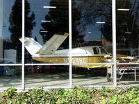 N3248C @ CCR - Resting in Pacific States display window. - by Bill Larkins