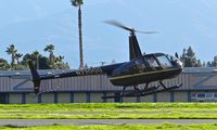 N220GG @ KRHV - Locally-based 2009 Robinson R44 II landing runway 31R at Reid Hillview Airport, San Jose, CA. - by Chris Leipelt