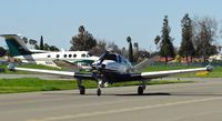 N69XG @ KRHV - Club 200 Knots LLC (Palo Alto, CA) 1976 Beechcraft V35B Bonanza taxing back for departure at Reid Hillview Airport, San Jose, CA. - by Chris Leipelt