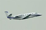 D-CAHO @ EGGW - 2014 Cessna 560XL Citation Excel, c/n: 560-6165 climbs into the grey skies over Luton - by Terry Fletcher