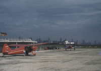 N9156K - This photo probably was taken at Meigs Field in Chicago.  The white building in the background seems to match the one in the aerial picture beside the causeway under The Airport Opens at http://friendsofmeigs.org/html/history/meigs_history.htm - by Franklin Miller by his son Lohring Miller