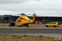 OO-NSF @ EGPD - Reception Committee at Aberdeen airport EGPD at 1245hrs local time 2016-03-19 on its delivery flight for newly based NHV Helicopters. To join sister ships 'D' and 'E' already in situ. Note the towing tractor is ... a tractor. - by Clive Pattle