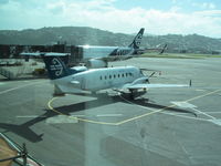 ZK-EAF @ NZWN - through terminal window - by magnaman