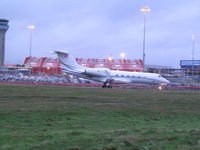 OE-ILE @ EGGW - taxying in in gloom at Luton - by magnaman