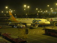 RP-C3250 @ ZGGG - night visitor to CAN - view from terminal - by magnaman