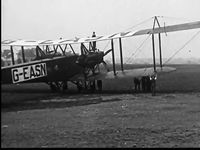 G-EASN - Still from 1923 film From London to Paris by Air in the public domain via The Prelinger Archive.  Shows crew finishishing unfolding and locking the starboard wing into place for an English Channel crossing. - by Unknown