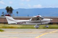 N934TR @ KRHV - Locally-based 1977 Cessna 172N departing runway 31R at Reid Hillview Airport, San Jose, CA. - by Chris Leipelt