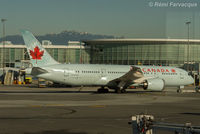 C-GHQQ @ CYVR - Tow into gate at International terminal - by Remi Farvacque