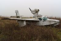 C-FQIP @ EGTR - View from the other side. Taken on a quiet cold and foggy day. Sadly looking rather shabby after being exposed to the elements for a very long period of time and is gradually being engulfed by the plant life around it. - by Glyn Charles Jones