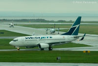 C-FBWJ @ CYVR - Taxiing to domestic after north runway landing. - by Remi Farvacque