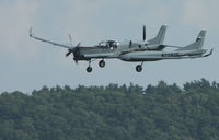 N2082C @ ELM - I shot this through the windshield of a friend's car while driving as it was coming in for a landing.  I was using a 100-400mm Canon lens at 400mm, 1/800 @ F11.  Right place at the right time. - by Marty Pierce