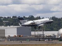 N345XB @ KBFI - Bombardier leaving Boeing Field. - by Eric Olsen