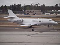 N215RE @ KSNA - Falcon 2000 taxing for takeoff at the John Wayne Airport. - by Eric Olsen