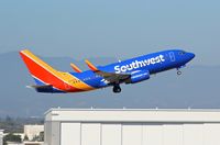 N708SW @ KSJC - Southwest departing in their 1998 Boeing 737-700 at San Jose International Airport, CA. - by Chris Leipelt