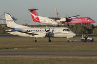 VH-VEP @ YBBN - VEP under the tow while QOH starts the flare onto one niner - by V8Bathurst888