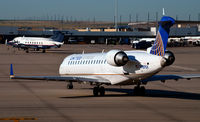 N789SK @ KDEN - Taxi for takeoff Denver - by Ronald Barker