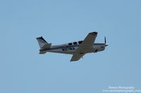 N371RA @ KSRQ - Beechcraft Bonanza (N371RA) departs Sarasota-Bradenton International Airport - by Donten Photography