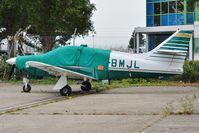 G-BMJL @ EGHH - All wrapped up in the July weather - by John Coates