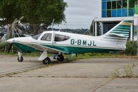 G-BMJL @ EGHH - Being readied for departure - by John Coates